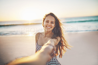 Buy stock photo Cropped shot of a young woman pulling someone's hand at the beach