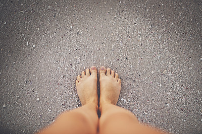 Buy stock photo High angle shot of a woman's feet at the beach