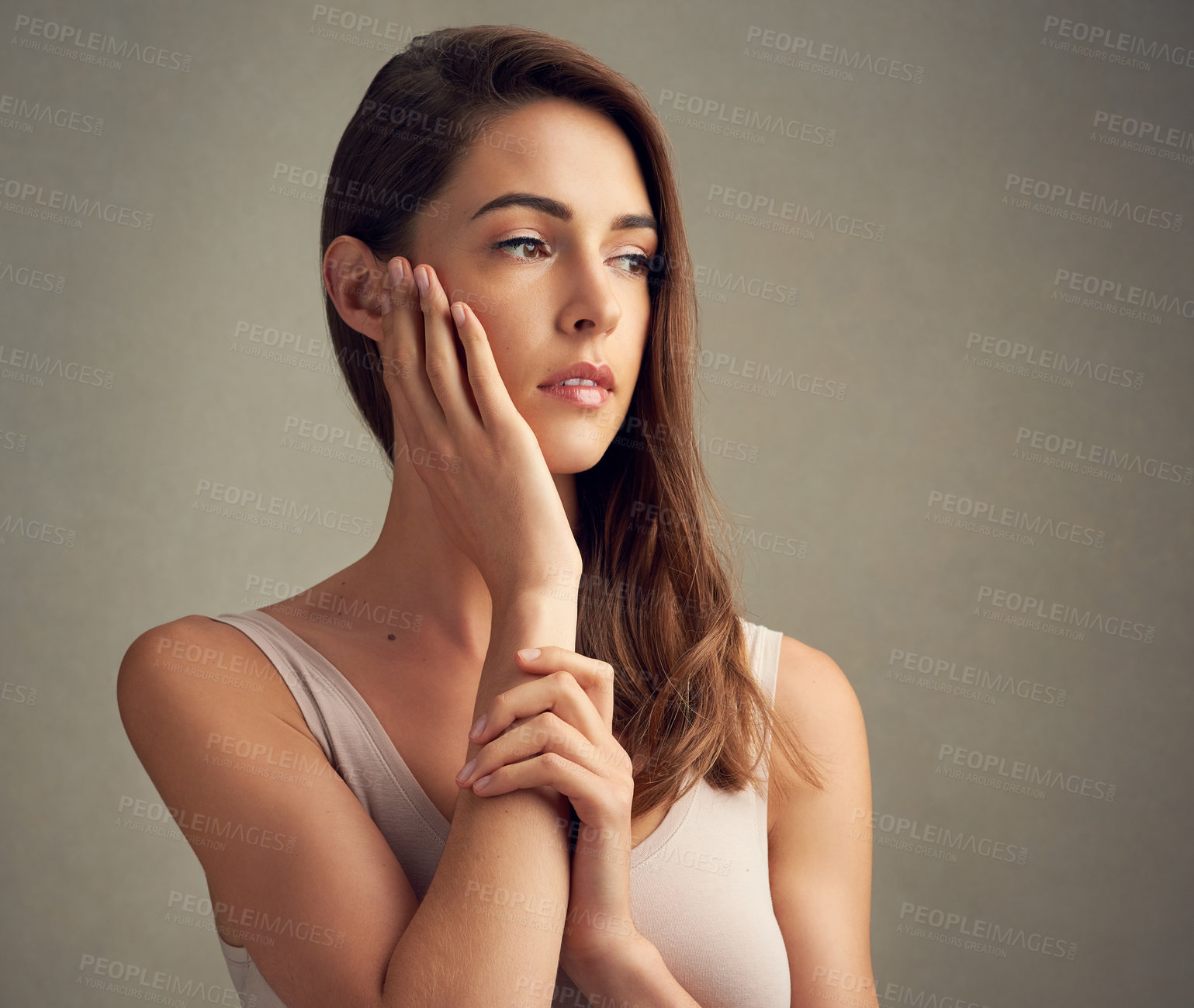 Buy stock photo Beauty, thinking and hands on face of woman in studio for cosmetics, hair care and wellness. Salon, aesthetic and person thoughtful for treatment, natural skincare and texture on background.