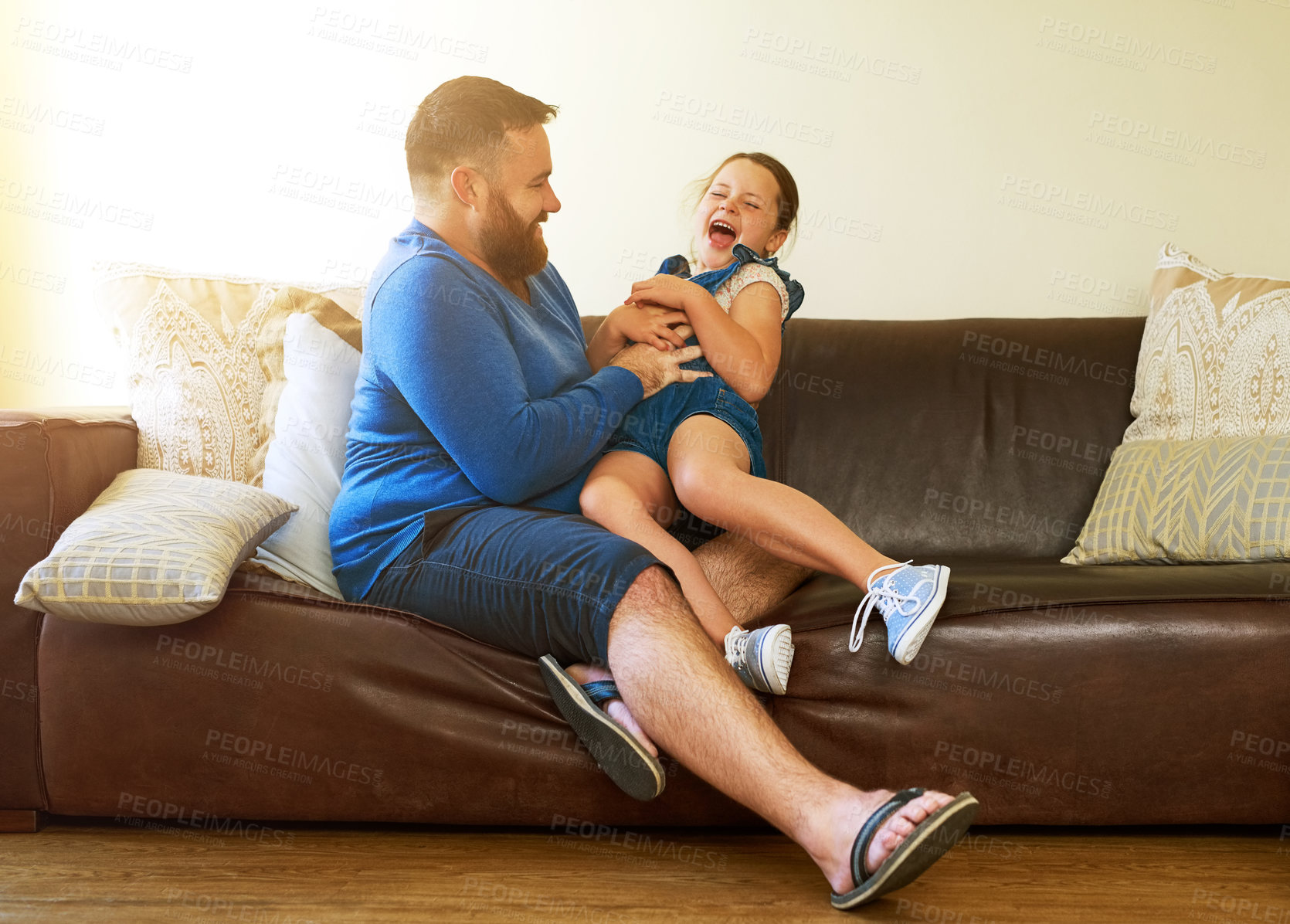 Buy stock photo Tickle, playing and father with kid on sofa in home for bonding, relationship and happy together. Family, parenting and dad with girl for care, fun and laugh in living room on holiday or weekend