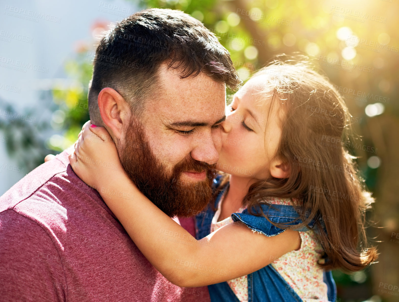 Buy stock photo Dad, kid and kiss in garden with smile, hug and bonding on outdoor weekend with care. love and respect. Holiday, father and girl in backyard together in support, trust or happy growth with embrace.