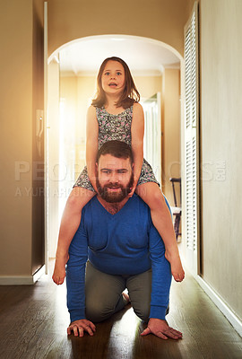Buy stock photo Shot of an adorable little having fun with her father at home