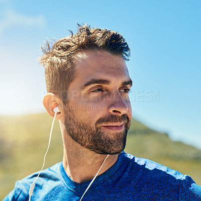 Buy stock photo Thinking, running and face of man with earphones for music streaming, fitness and outdoor exercise. Relax, calm and runner listening podcast with inspiration, blue sky and morning workout challenge