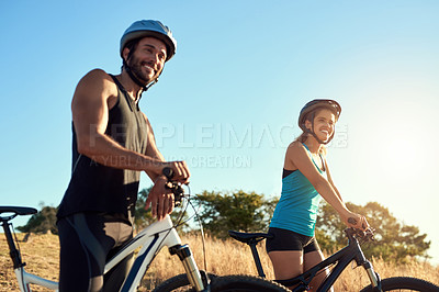 Buy stock photo Happy couple, nature ride and cycling in the mountains for fitness and exercise together. Bike wellness and young people with outdoor adventure and sports training with happiness and freedom mockup