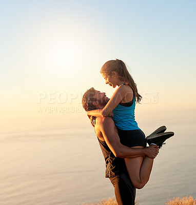 Buy stock photo Outdoor, lift and couple with fitness, hug and energy with training, strong and workout. View, ocean and healthy man with woman, embrace and exercise with relationship, motivation or nature with love