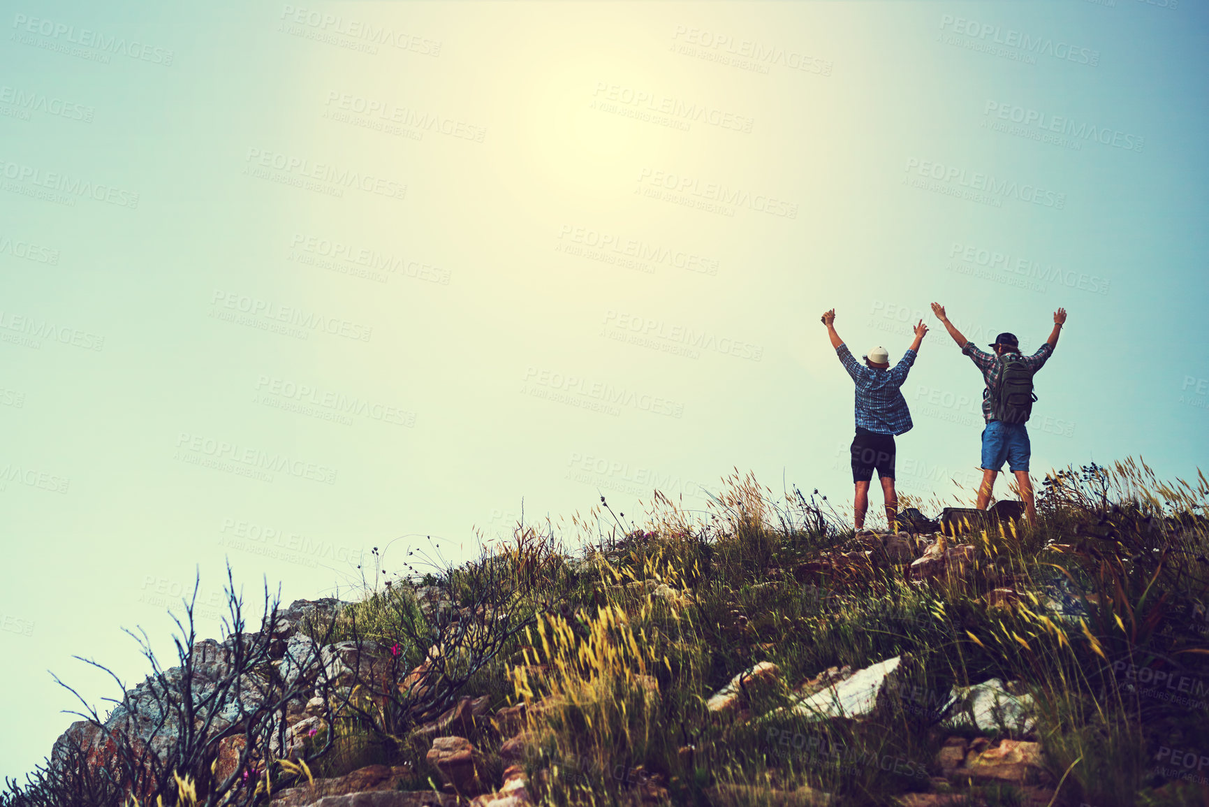 Buy stock photo Mountain, people and hike with victory or open arms  for fitness, explore and adventure in back view. Survival, mockup space and excited with achievement on holiday or vacation in nature with freedom
