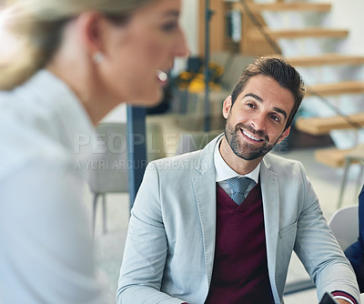 Buy stock photo Cropped shot of a businessman in a boardroom meeting with his colleagues