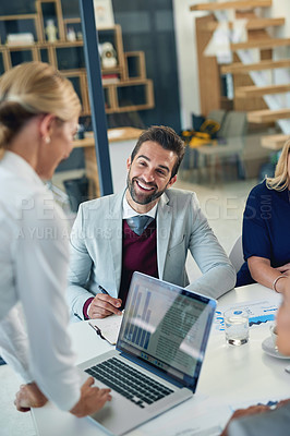 Buy stock photo Cropped shot of a businessman in a boardroom meeting with his colleagues
