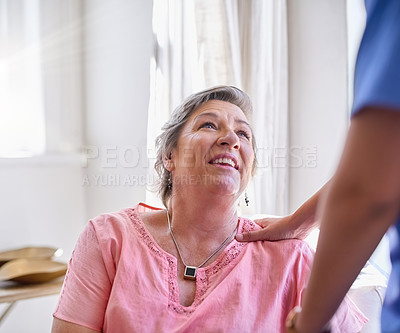 Buy stock photo Cropped shot of a caregiver assisting a senior patient in a nursing home