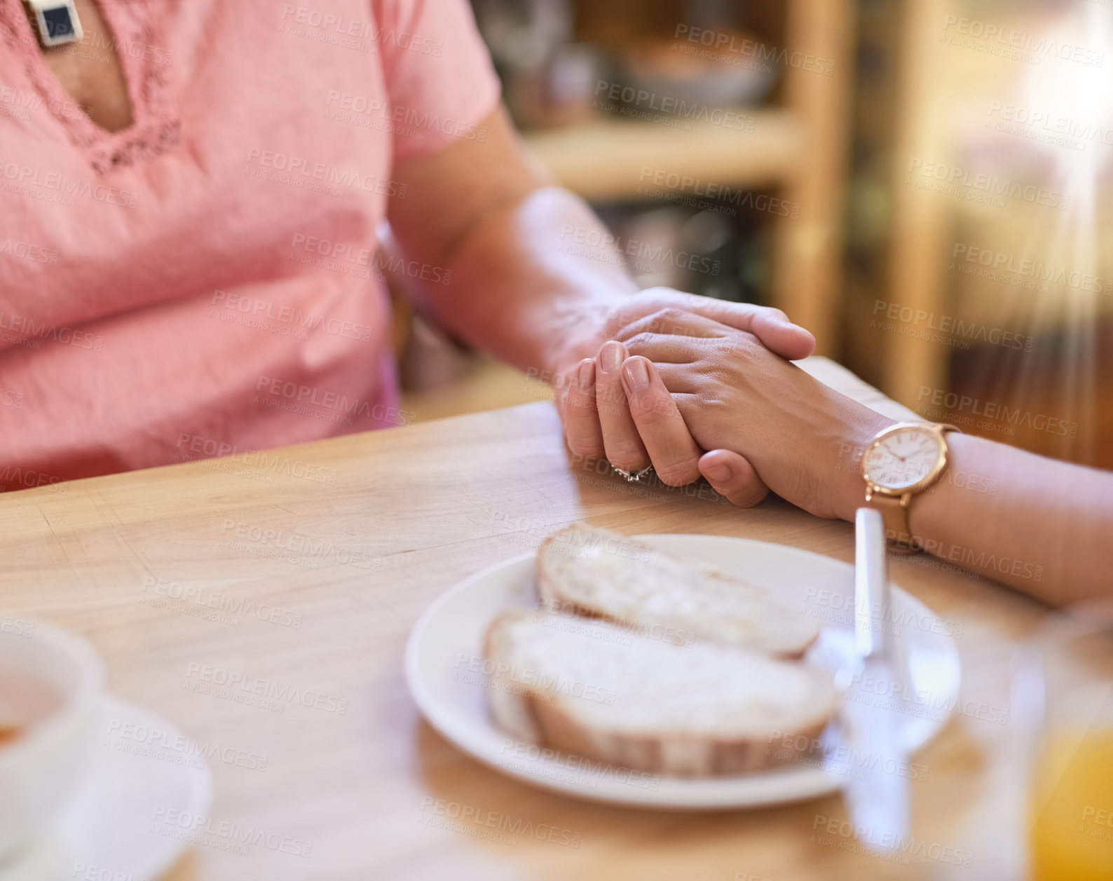 Buy stock photo People, holding hands and support in nursing home for help, trust and hope in living room. Women, comfort and senior care at wooden table for grief counselling, empathy and assistance in retirement