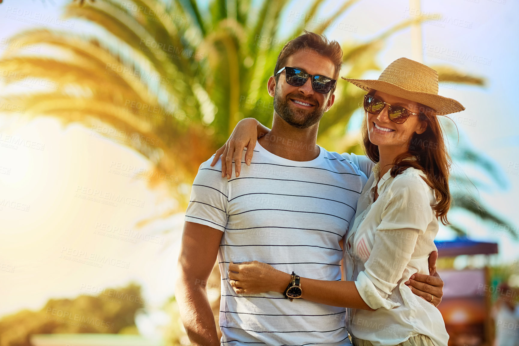 Buy stock photo Couple, people and smile on hug in outdoor with sunglasses for summer holiday, relax and fun in Spain. Relationship, portrait and happy with support on vacation, trip and travel together as soulmate