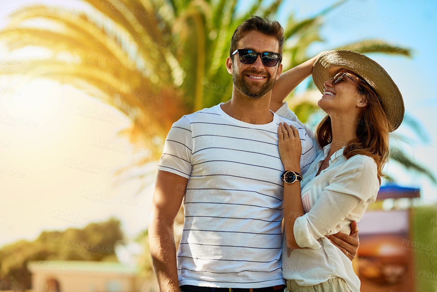 Buy stock photo Couple, people and happy on holiday in outdoor with sunglasses for summer exploring and fun in Spain. Relationship, love and smile with support on vacation, trip and travel together as soulmate