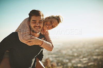 Buy stock photo Shot of an affectionate couple spending the day out in nature