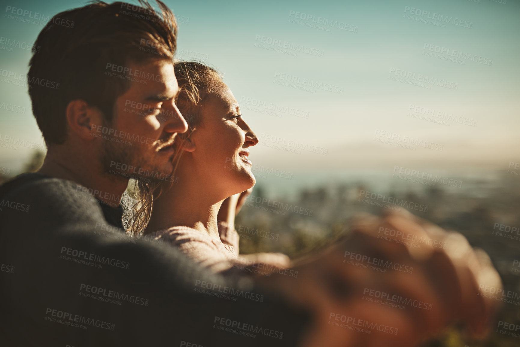 Buy stock photo Mountain, view and couple with smile in hug for summer holiday, love and outdoor adventure. Blue sky, man and woman with happiness in embrace for weekend vacation, sunset and sightseeing in Norway