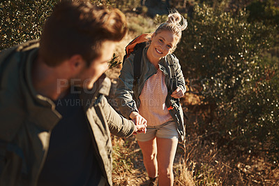 Buy stock photo Shot of a couple spending the day out hiking