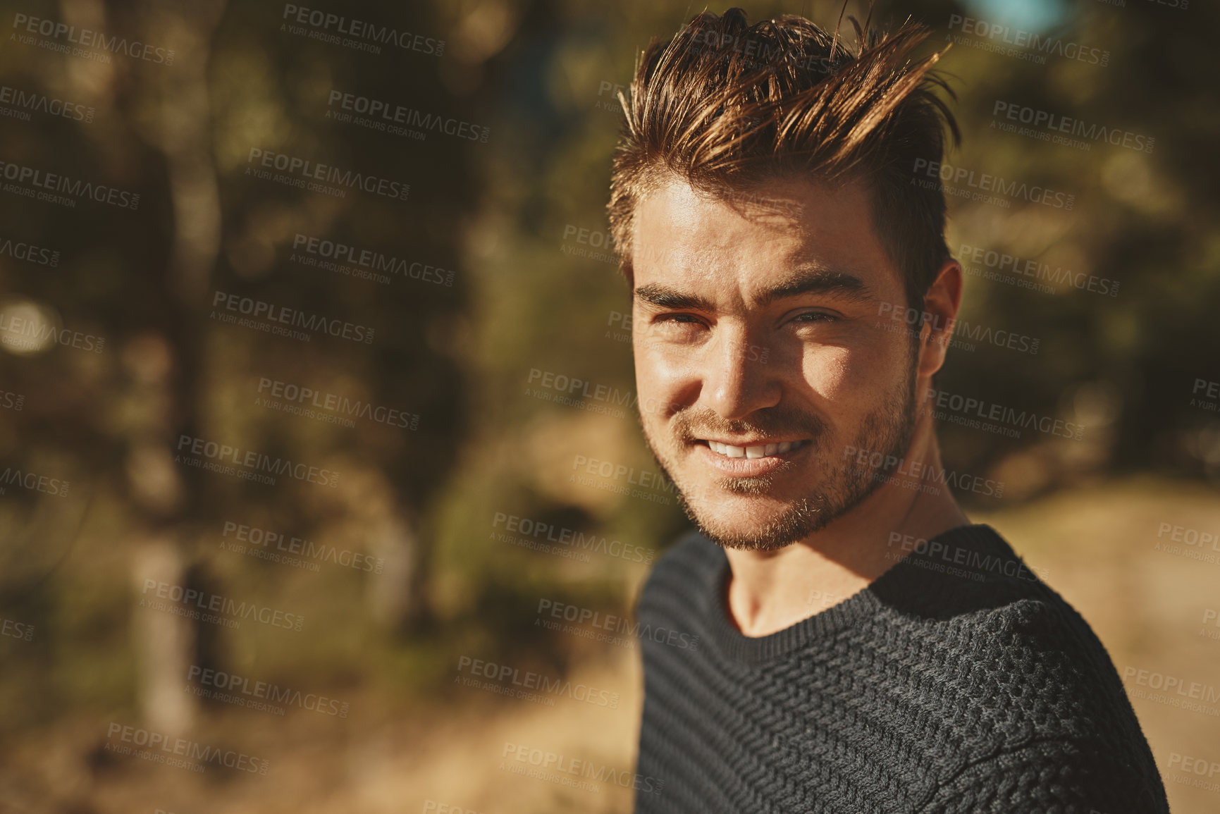 Buy stock photo Cropped shot of a young man spending the day outdoors