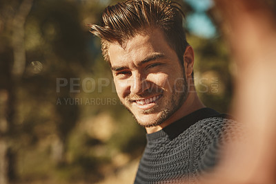 Buy stock photo Cropped shot of a young man spending the day outdoors