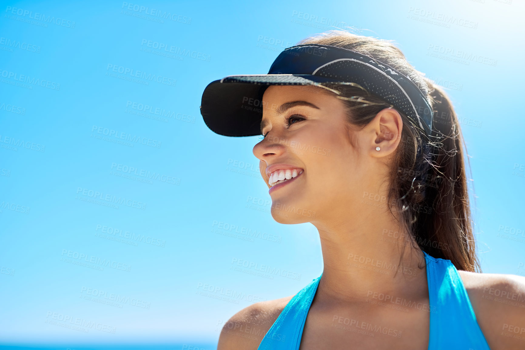 Buy stock photo Woman, happy and blue sky outdoor for fitness, exercise and sunshine with motivation or positive mood. Female person, smile and athlete by beach for workout, training and sports in summer with space