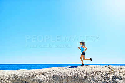 Buy stock photo Shot of a young woman out running