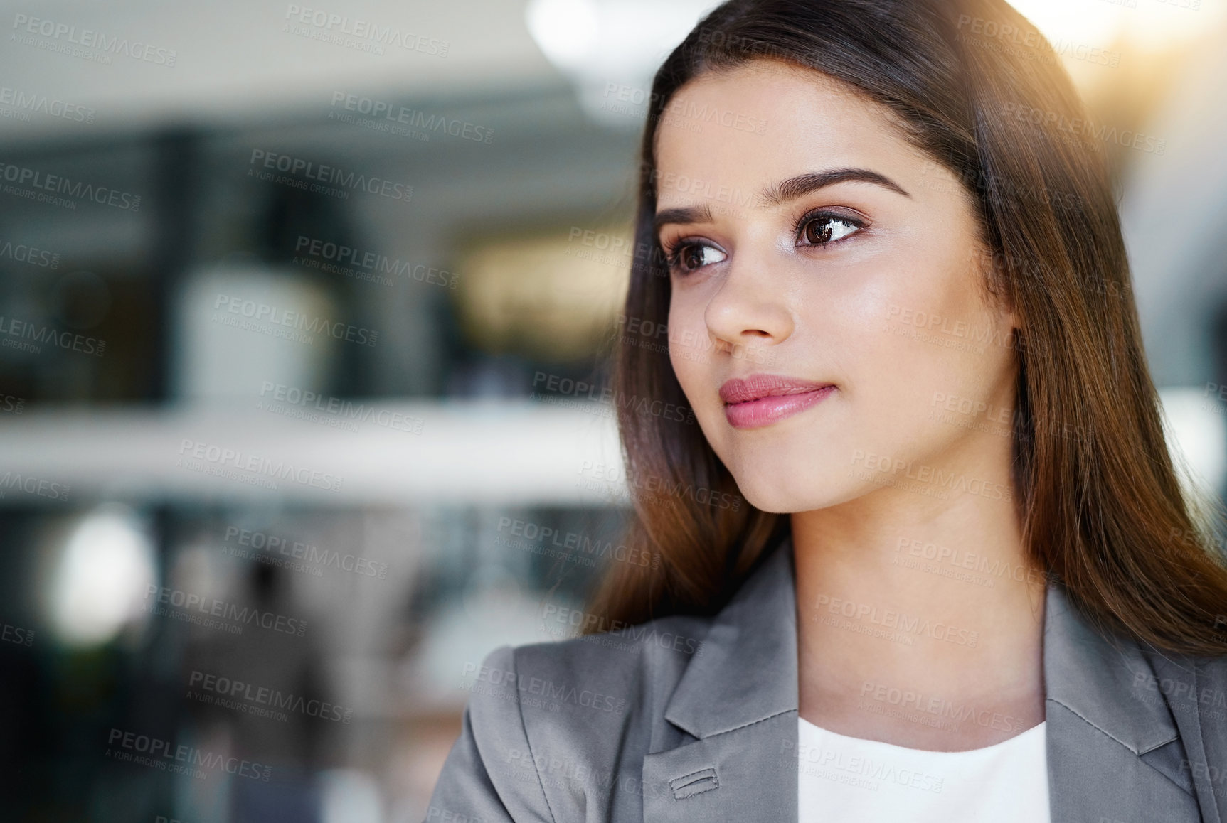 Buy stock photo Cropped shot of an attractive young businesswoman standing in her office
