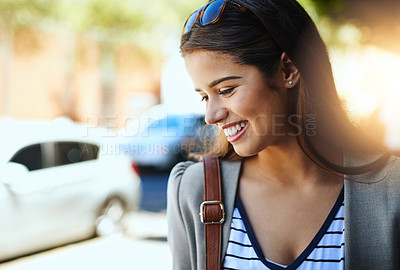 Buy stock photo Cropped shot of an attractive young woman on her morning commute to work