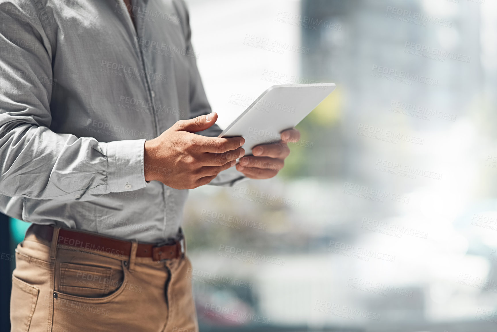 Buy stock photo Businessman, hands and browsing with tablet for news, research or onlline connection at office. Closeup of male person, employee or analyst on technology app, development or mockup space at workplace