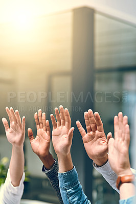 Buy stock photo Cropped shot of a group of unrecognizable businesspeople raising their hands