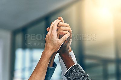 Buy stock photo Cropped shot of a group of unrecognizable businesspeople gripping each others' hands