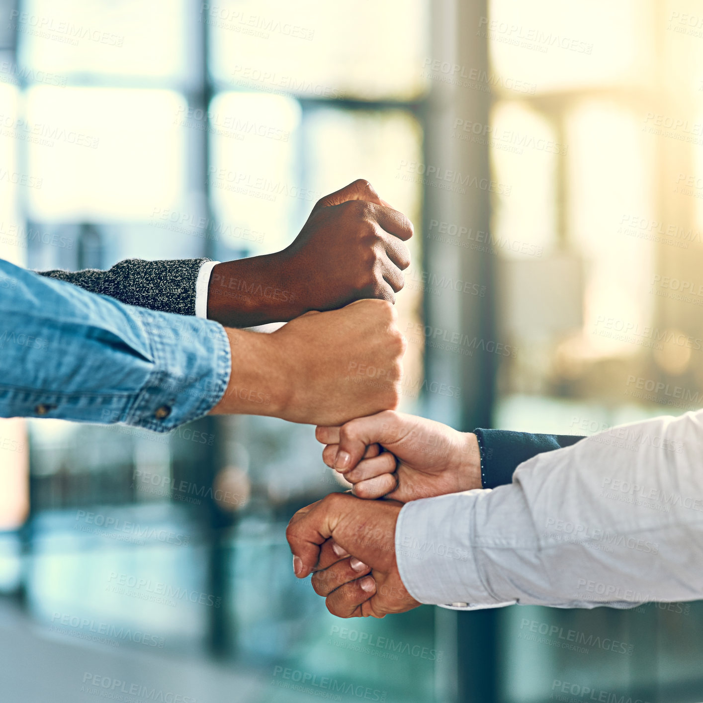 Buy stock photo Cropped shot of a group of unrecognizable businesspeople stacking fists