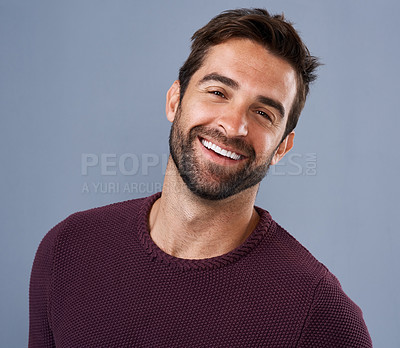 Buy stock photo Studio, face and smile of man, fashion and confidence in mockup space, pride and cardigan in winter. Blue background, portrait and person in Miami, happy and comfortable in clothes, joy and jersey