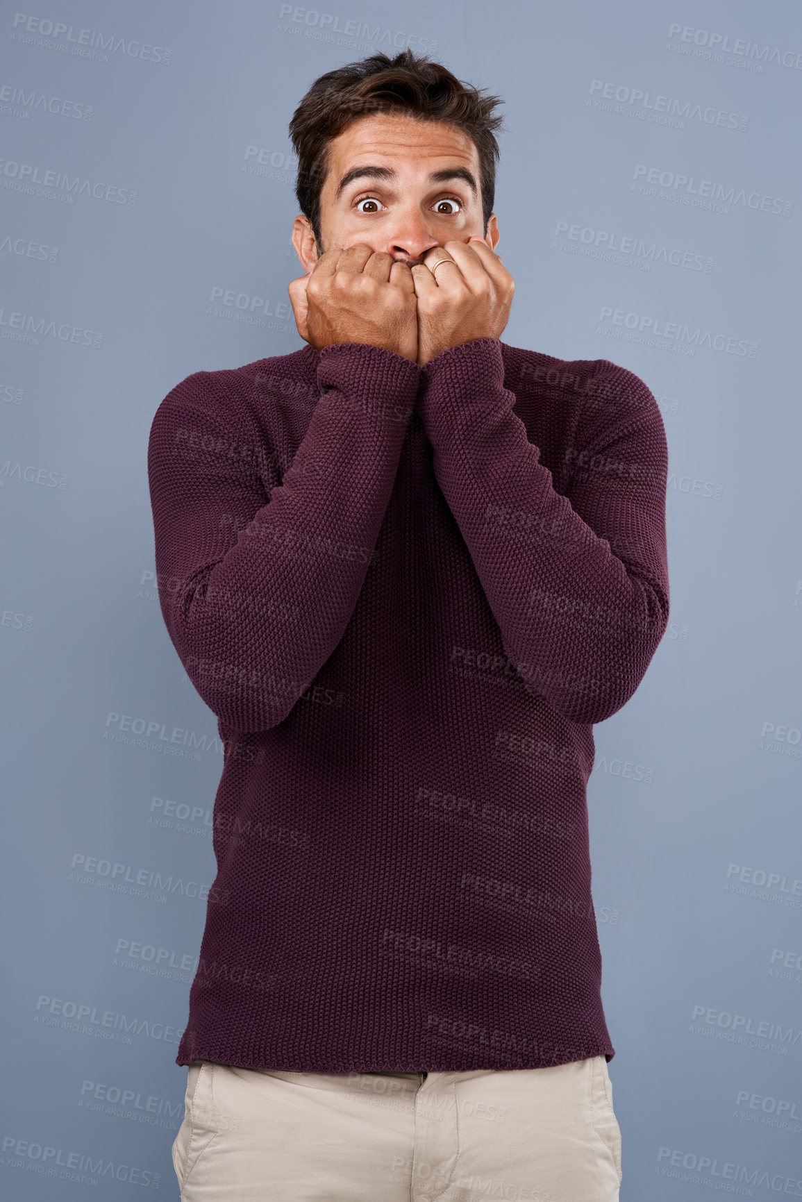 Buy stock photo Portrait, afraid and phobia of man in studio, anxiety and biting of nails for stress, scared and fear. Blue background, mockup space and person with terror for nightmare of fail in test of college