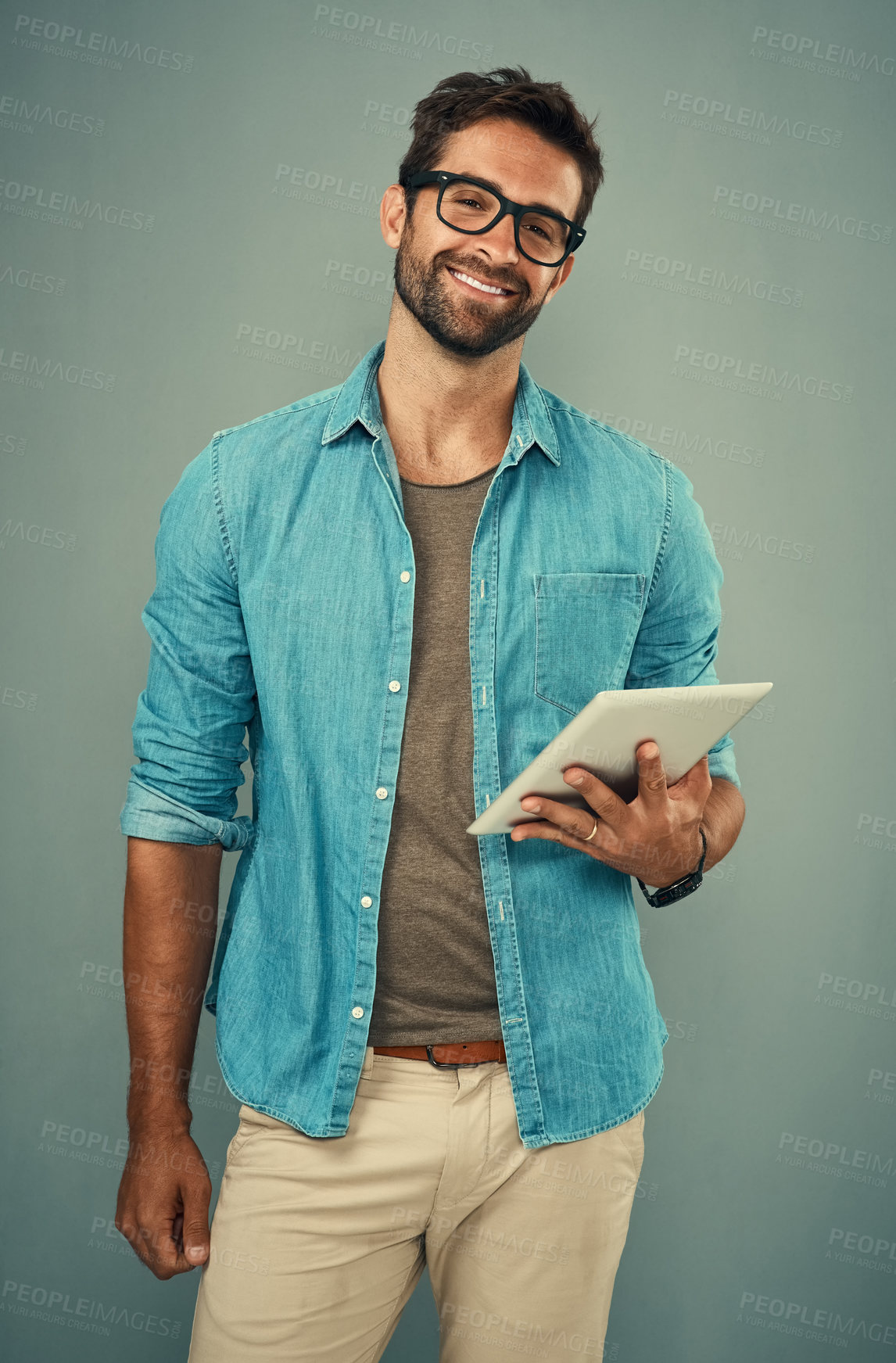 Buy stock photo Man, portrait and tablet by gray background with smile for social media, internet or website search. Fashion designer, happy and technology for b2b ecommerce, startup and online or digital catalog