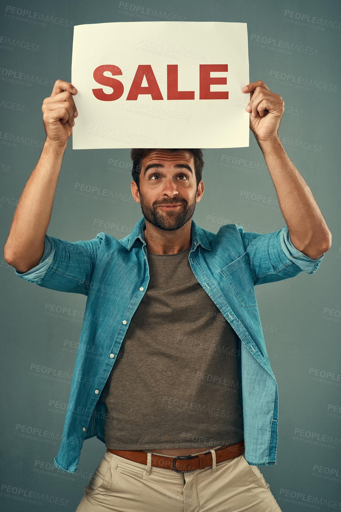 Buy stock photo Man, hands and sale on billboard for advertising, marketing or branding against a grey studio background. Male person or realtor holding board, sign or poster for sales announcement or advertisement