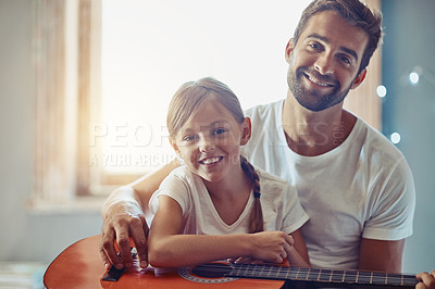 Buy stock photo Man, young girl and guitar with teaching and learning at home, bonding with love and creativity in portrait. Family, father and daughter learn to play musical instrument, lesson and music education