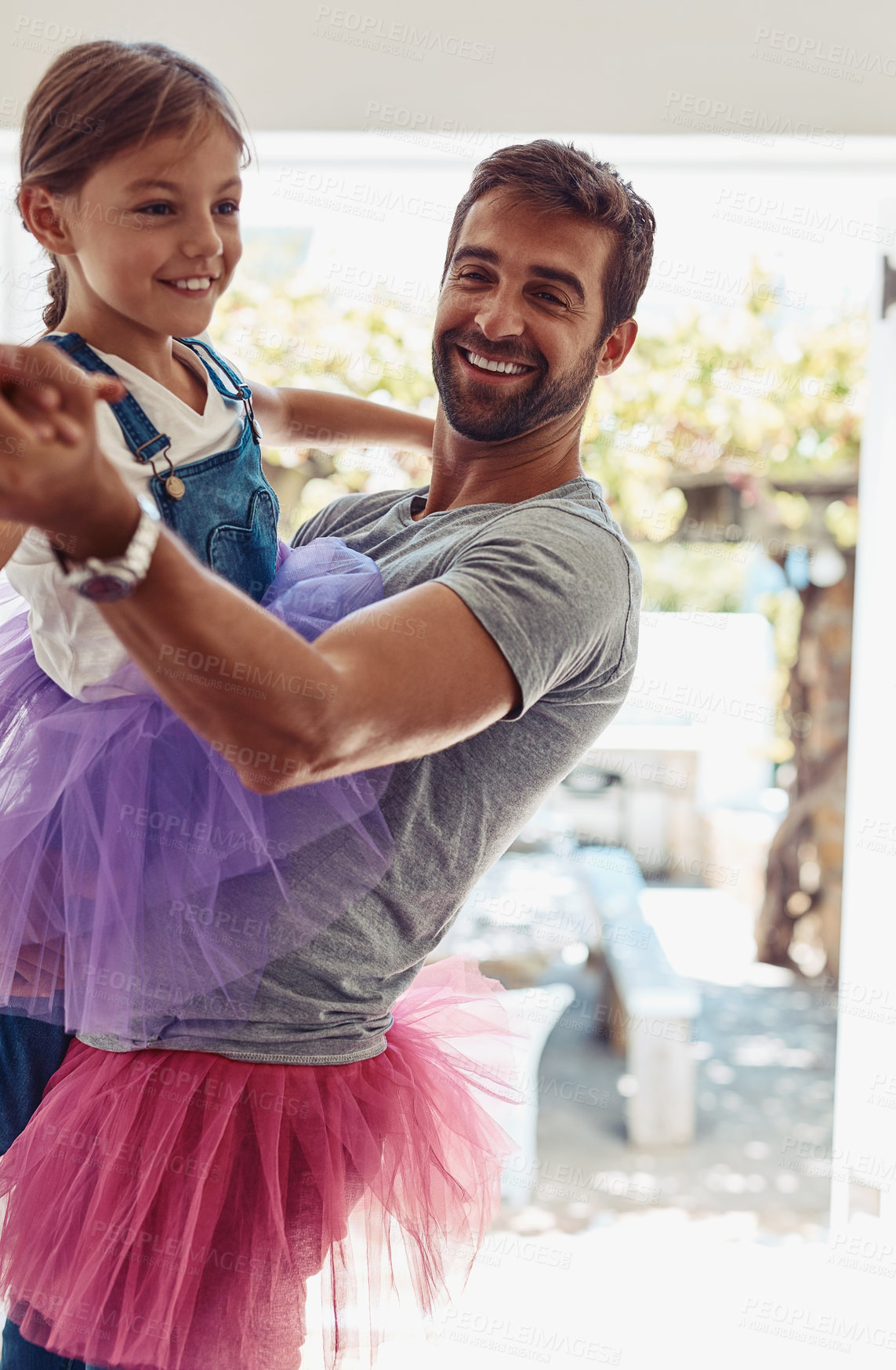 Buy stock photo Dad, girl and happy for dance in home with tutu skirt for fun, support and child development or growth. Parent, kid and smile as father with joy or laugh for comfort, trust and entertainment or play