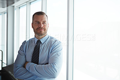 Buy stock photo Shot of a smiling businessman posing in an airport terminal