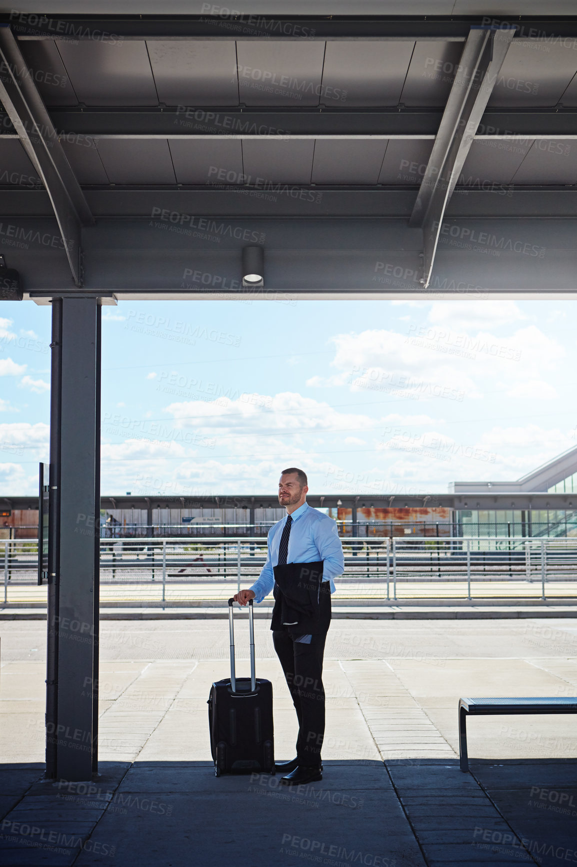 Buy stock photo Shot of a professional businessman waiting for transportation outside an airport
