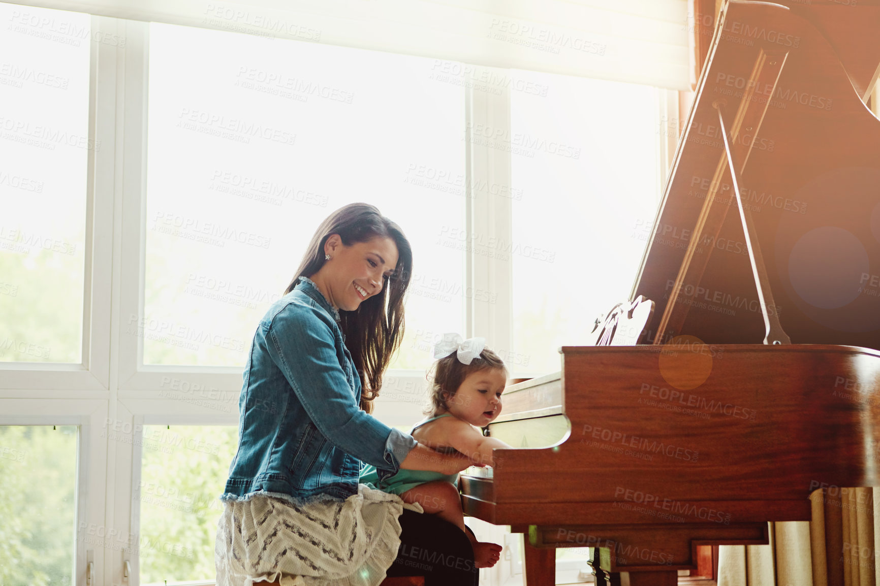 Buy stock photo Mom, baby and piano for learning music and playing at home with support, love and fun. Happy family, mother or woman with child and instrument for sound development, teaching and bonding together