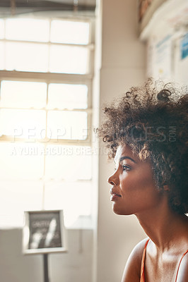 Buy stock photo Cropped shot of an attractive young woman sitting in a waiting room
