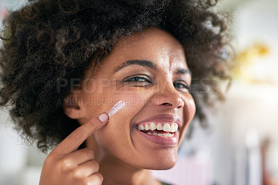 Buy stock photo Portrait, woman and face for cream by spf in home for wellness, protection and dermatology. Black person, happy or laugh with apply for skincare by treatment, pigmentation or hydration with vitamin c