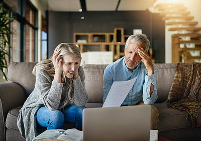 Buy stock photo Cropped shot of a couple looking anxious while doing their budget at home