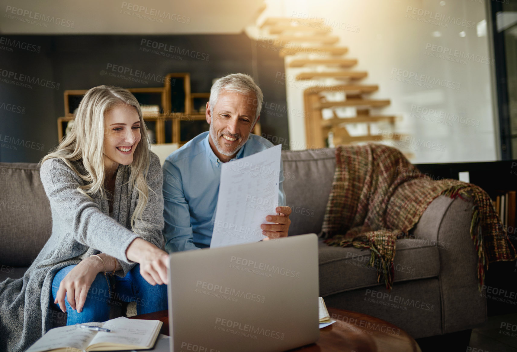 Buy stock photo Cropped shot of a couple going through their paperwork together at home