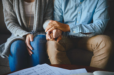 Buy stock photo Holding hands, senior couple and life insurance support with paperwork in a living room. Home, anxiety and elderly people with empathy, stress and trust with solidarity for bills and tax problem