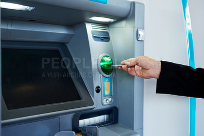 Buy stock photo Cropped shot of a businessman making a transaction at an ATM