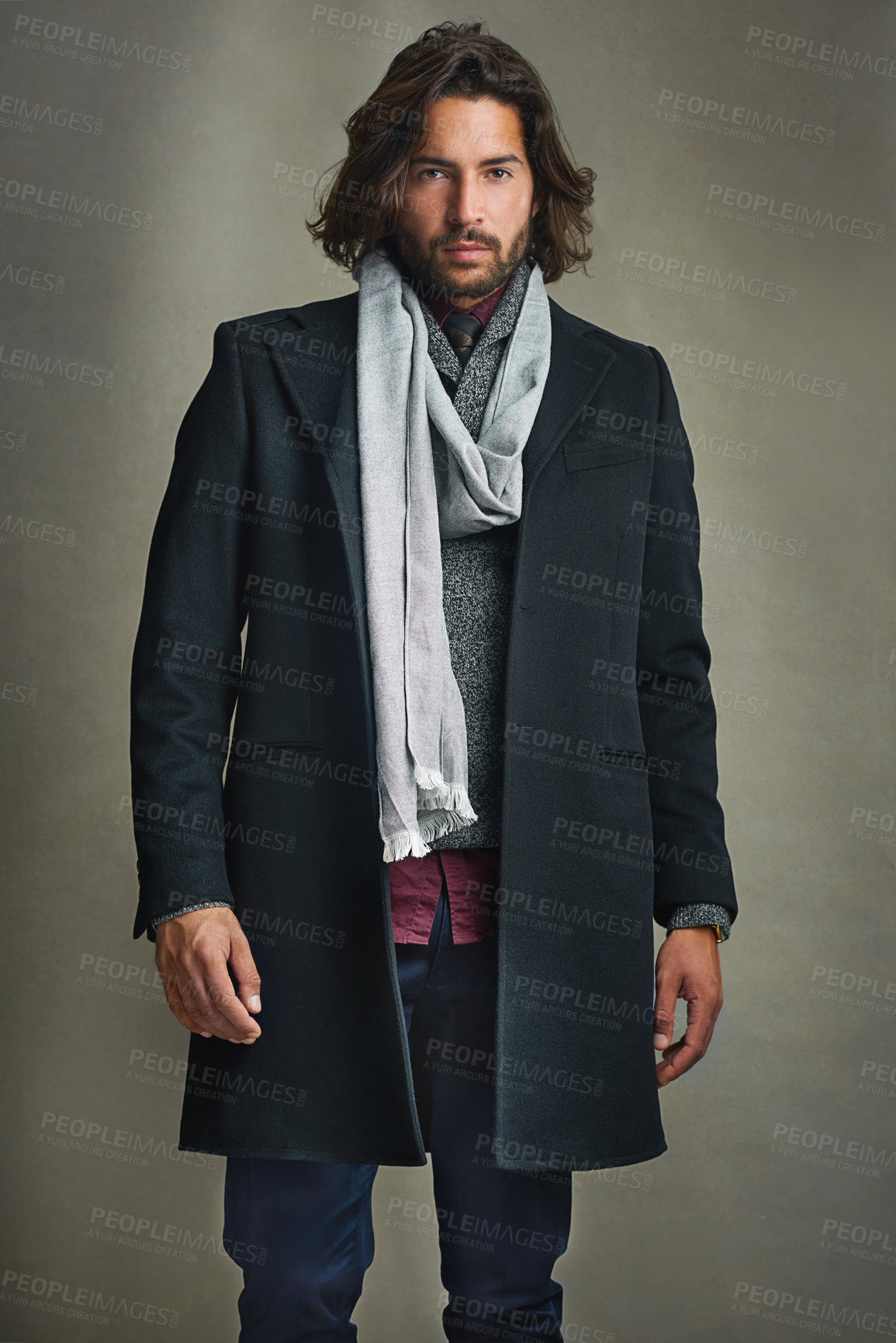 Buy stock photo Portrait of a stylishly dressed man posing against a gray background in the studio