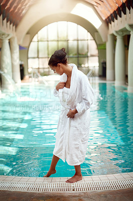 Buy stock photo Shot of an attractive young woman about to go for a relaxing swim at a spa