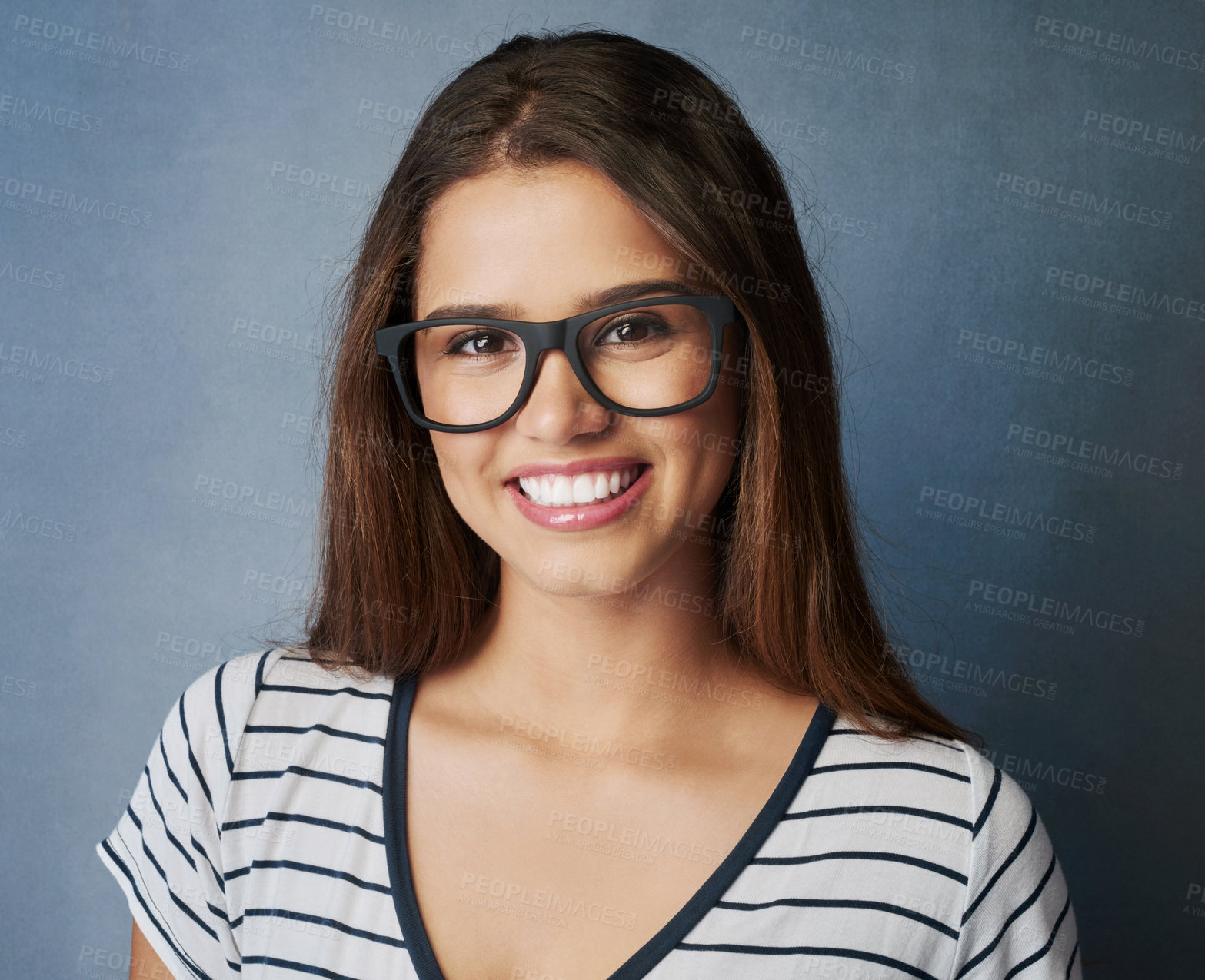 Buy stock photo Happy woman, portrait or glasses with optometry for sight, eyecare or accessory on a gray studio background. Young nerd, female person or model with smile, spectacles or expression for casual fashion