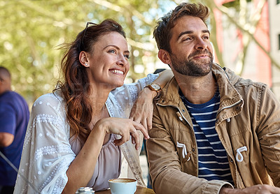 Buy stock photo Shot of two relaxed tourists taking a break at a sidewalk cafe