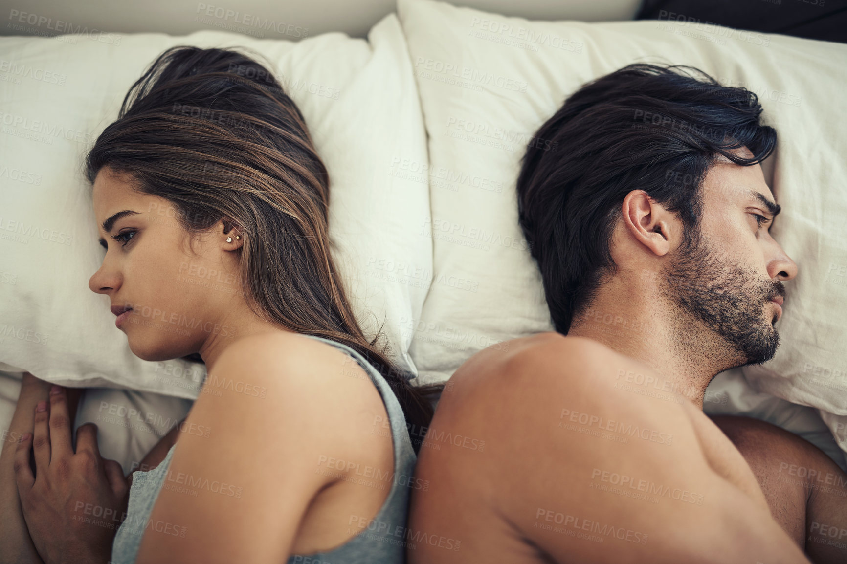 Buy stock photo Couple, frustrated and fight in bed for argument, marriage conflict and relationship drama in house. Man, woman and angry in bedroom for cheating, problem or erectile dysfunction in home with divorce