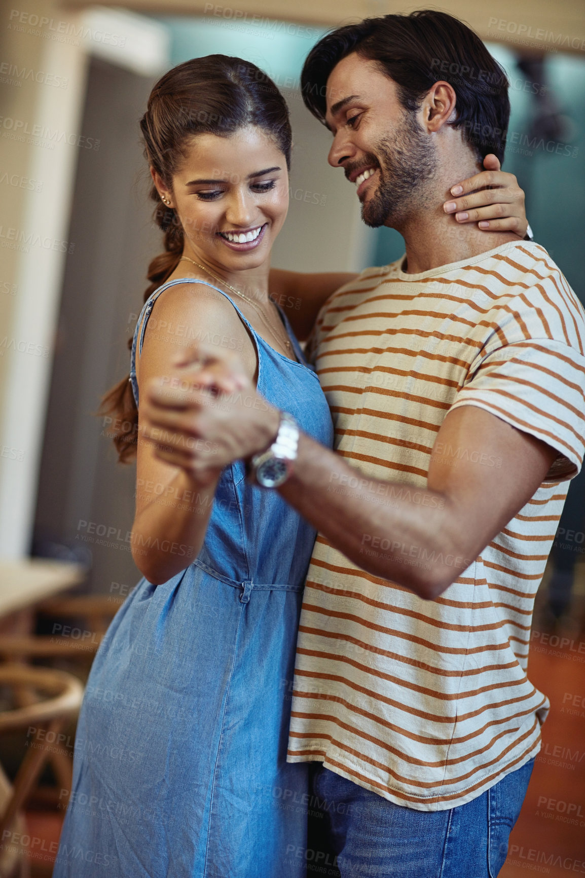 Buy stock photo Happy, couple and care with dance in home for romantic connection, bonding and loyalty in marriage. Man, woman and smile with holding hands in living room for anniversary, love and trust on weekend